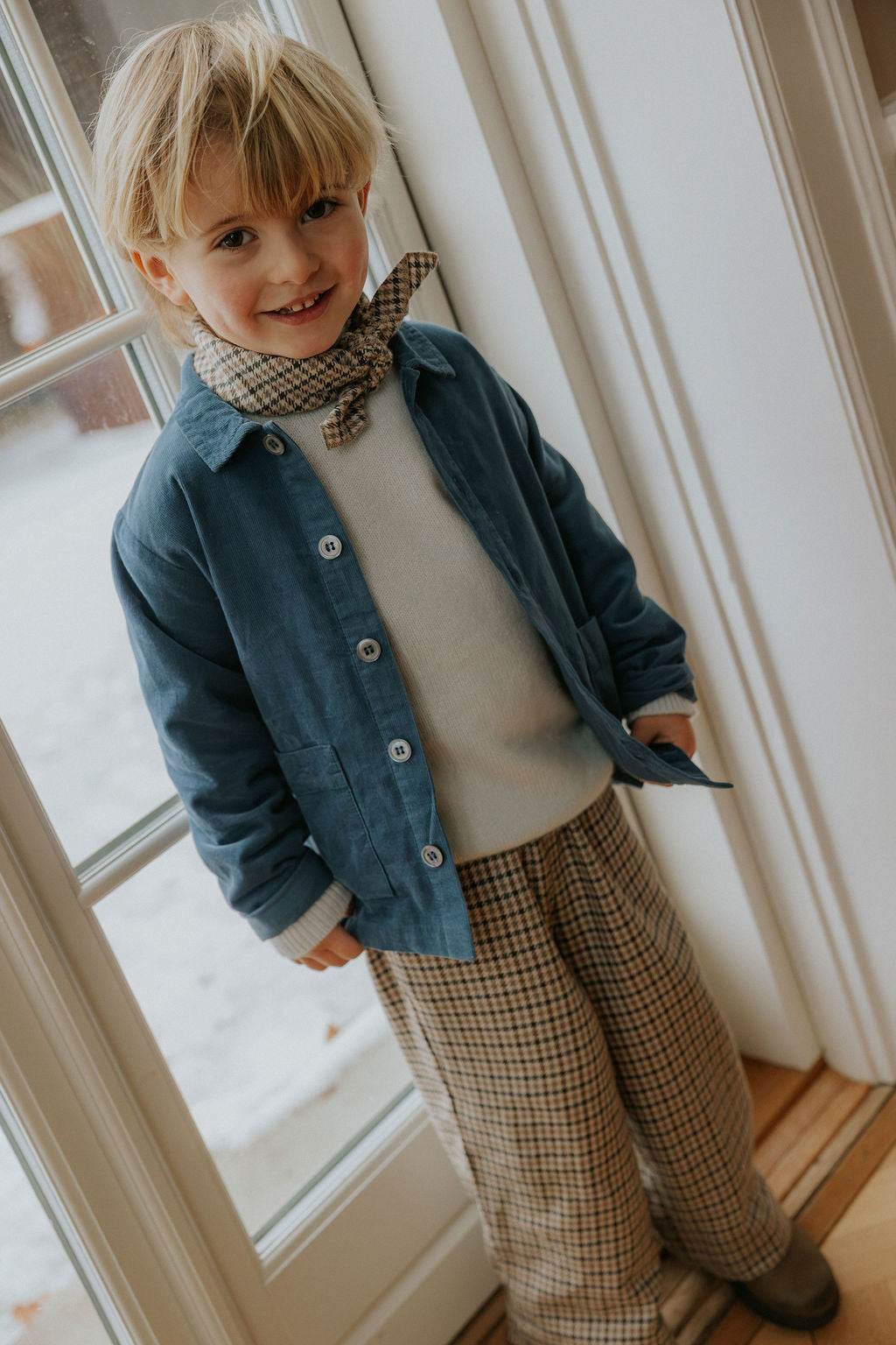 Boy wearing Lalaby Sam kids overshirt in whale blue cotton baby cord