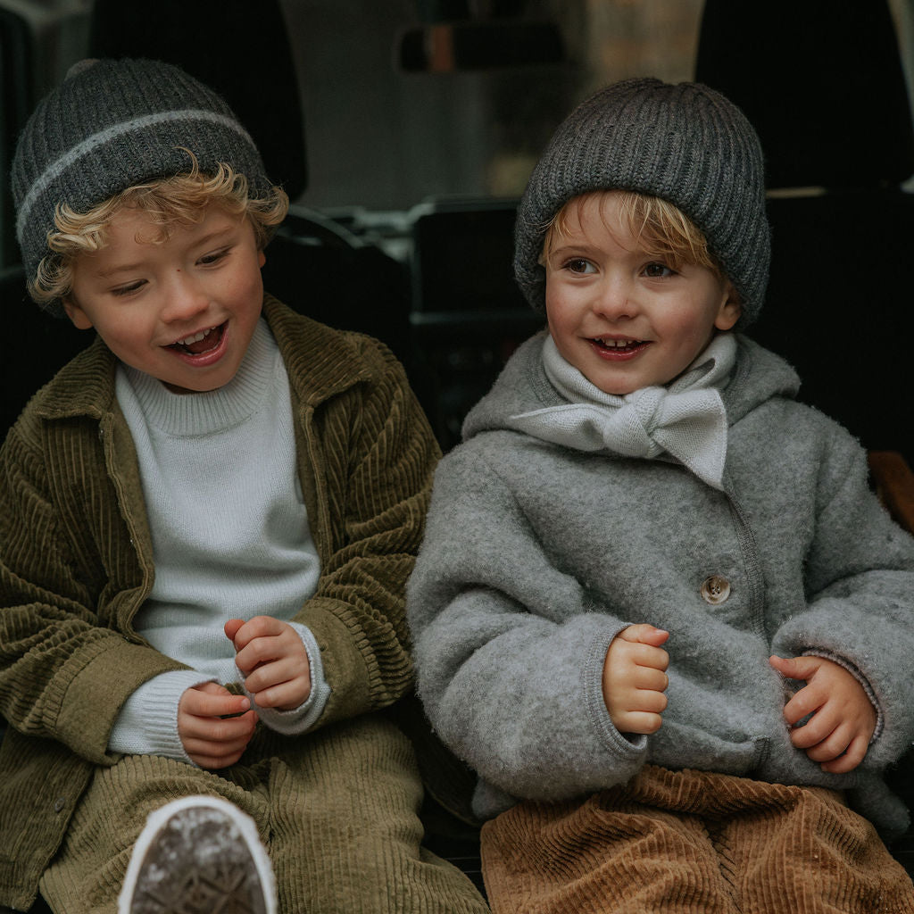 Boy wearing Lalaby Samson kids shirt in forest green organic cotton mega cord