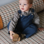 Baby boy wearing Lalaby Saxo baby shirt in tweedy check organic cotton