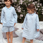Boy and girl wearing Lalaby summer pyjamas and pj dress for kids in sky blue organic cotton