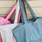 Lalaby Toto tote bags in three colorways; sorbet pink, natural beige and pool blue, made from organic cotton, for everyday use