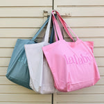 Lalaby Toto tote bags in three colorways; sorbet pink, natural beige and pool blue, made from organic cotton