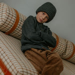 Boy wearing Lalaby Woody beanie in storm grey cashmere